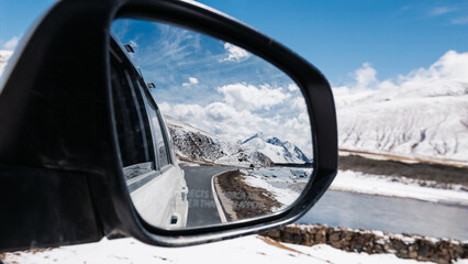 Driving car on high altitude mountain trail, China © lzf