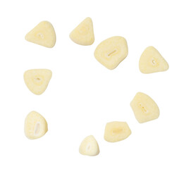 Top view set of white garlic slices or pieces scattering isolated with clipping path in png file format