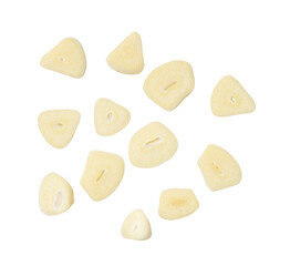 Top view set of white garlic slices or pieces scattering isolated on white background with clipping path