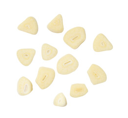 Top view set of white garlic slices or pieces scattering isolated with clipping path in png file format