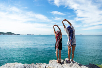 Happy traveler and tourism young women travel summer on the beach. relax outdoor destination...