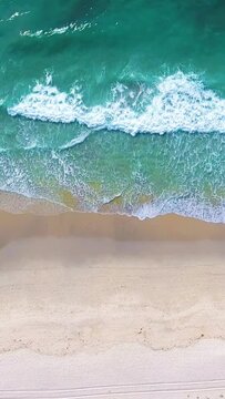 Aerial 4k: People on the beach on a hot summer afternoon