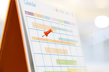 Pin on blank desk calendar in office workplace concept time management event planner or personal...
