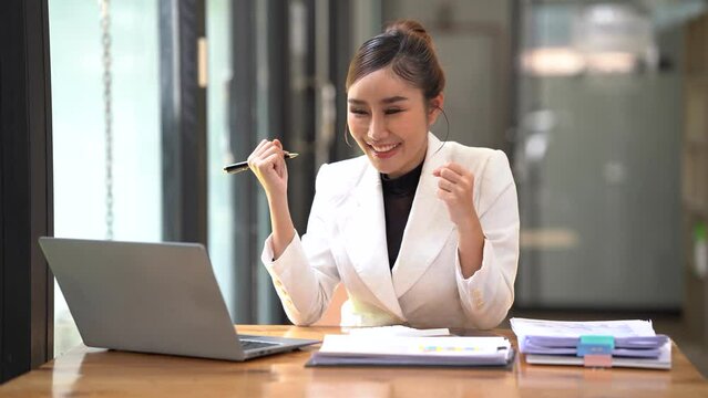 Successful business concept, Businesswoman holds and point financial document to analyzing dat