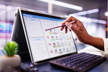 Digital Businesswoman Organizing Calendar Appointments and Meetings on Laptop