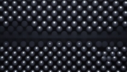 Close-up of a geometric pattern featuring metallic spheres arranged in rows, creating an abstract and futuristic background with a sleek, industrial feel.