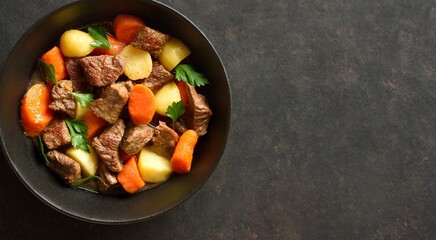 Beef stew with potatoes, carrots and greens