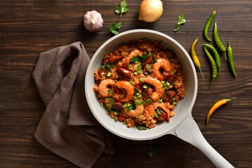 Creole jambalaya with prawn, smoked sausages and vegetables in pan