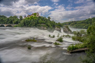 amazing largest water falls in Europe Rhein falls placed in Switzerland is famous travel destination that we can see Schloss Laufen , bridge and railway 