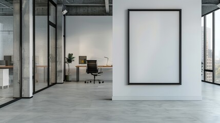 A modern office with a large black frame with copy space on a glass partition wall, near a sleek desk and ergonomic chair.
