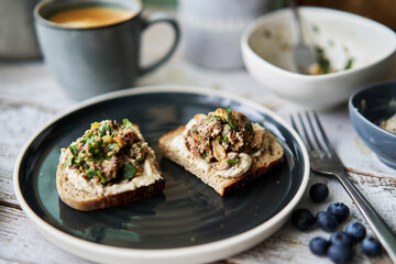 delicious homemade open face sandwich, topped with smashed sardine and olive oil