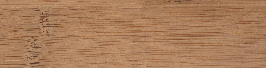 Naklejka premium A close up view of a dark bamboo wooden surface. Panoramic wood veneer texture.