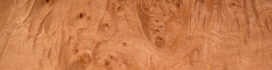 Maple briar veneer with unique, swirling eye patterns and warm tones