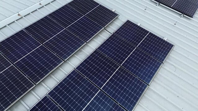industry uses green energy solar panels on the roof