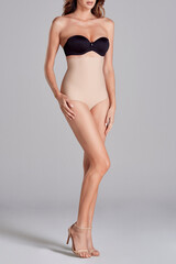 Female model wearing corset  bra and women underwear.