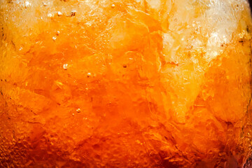 close up of fizzy drink with ice cubes