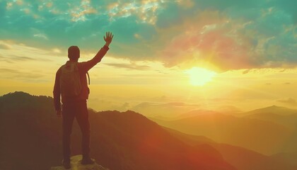 Fototapeta premium Reaching new heights: A man's triumphant ascent to the top of the mountain at sunset. Exploring free