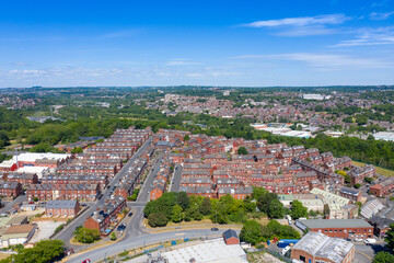 Aerial photo of the town centre of Armley in Leeds West Yorkshire on a bright sunny summers day showing rows of typical British terrace houses