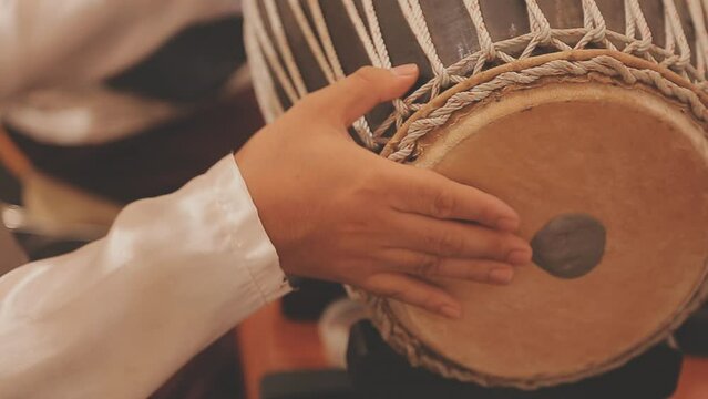Man drumming in Indian wedding ceremonies, selective focus.