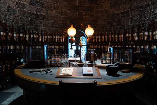 JAPAN - Nov 13, 2023: Vintage apothecary room with shelves lined of potion bottle laboratory equipment and book on the table at Warner Bros. Studio Tour Tokyo, The Making of Harry Potter