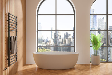Wooden hotel bathroom interior with bathtub and towel rail, panoramic window
