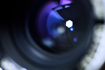 close up of the lens surface and it's aperture blade inside.