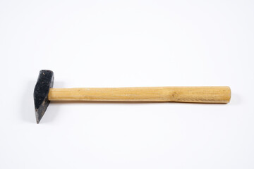 Carpenter hammer with wooden handle on an isolated white background.