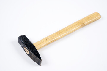 Carpenter hammer with wooden handle on an isolated white background.