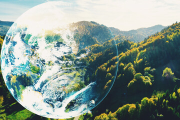 Fototapeta premium Save the planet. Beautiful mountains and planet Earth, double exposure