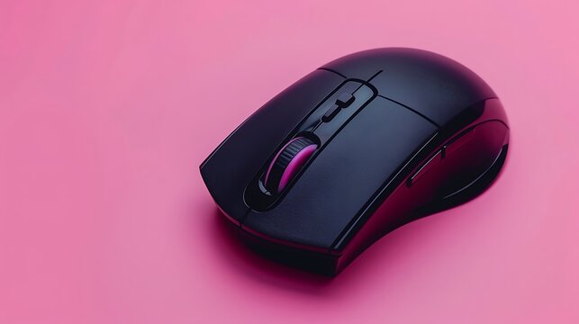 Black wireless computer mouse isolated on pink background