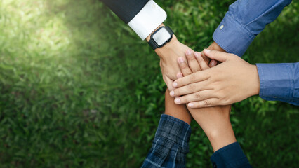World environment day with global community teamwork, A group of volunteer, business joins hands...