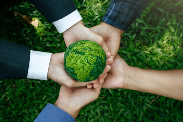 Environment World Earth Day Concept. Hands of People holding green globe for Care, Saving Protecting Planet Together. Sustainable environment development. Green business, Energy Renewable