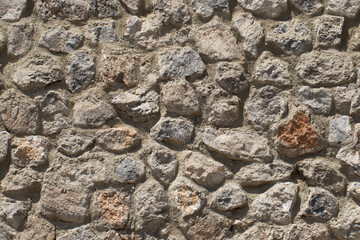 Texture of a stone wall to prevent landslides on the side of a highway