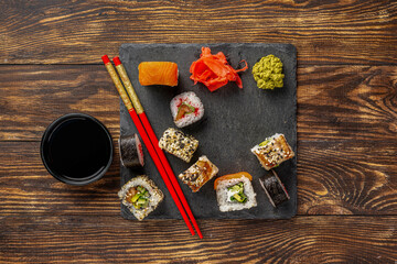 A colorful sushi sampler:
A vibrant assortment of maki rolls, bursting with different fillings and...