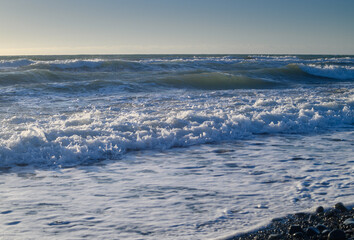 Mediterranean sea waves foam on the beach of Cyprus
