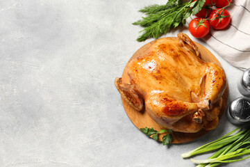 Tasty roasted chicken with different products on light grey table, flat lay. Space for text
