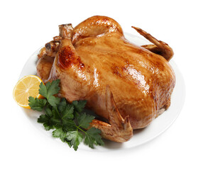 Tasty roasted chicken with parsley and lemon isolated on white