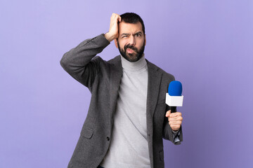 Adult reporter man with beard holding a microphone over isolated purple background with an...