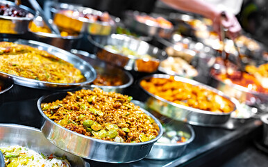 Traditional Asian dishes sold in a food court in Singapore