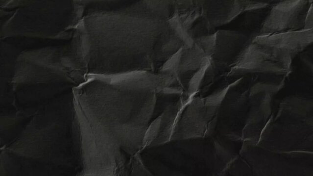 Seamless paper texture background for overlays. Looping dark grunge paper texture. Paper stop motion background. Black paper texture background. Surface Texture Background with Dark Grunge Highlights.