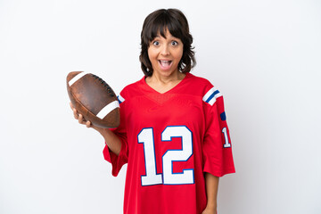 Young woman playing rugby isolated on white background with surprise facial expression