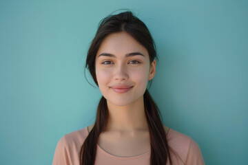Fototapeta premium A close up portrait of a young woman with a subtle smile