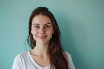 A close up portrait of a young woman with a subtle smile