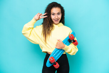Young Arab woman isolated on blue background with a skate with happy expression