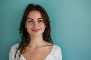Fototapeta premium A close up portrait of a young woman with a subtle smile