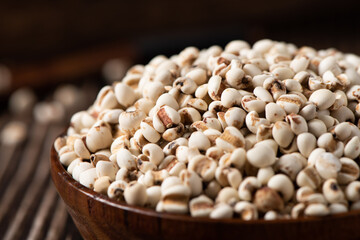 closed up of Job's tears in wooden bowl.