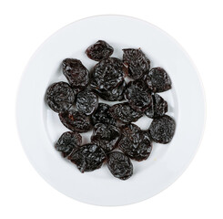 Prunes on a plate. On a white background