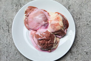melted ice cream in a dish, as a dessert