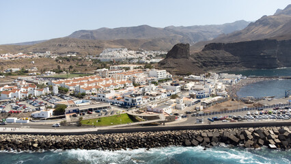 Obraz premium Aerial view of the town of Puerto de las Nieves, next to Agaete on the island of Gran Canaria, Spain. Sea and mountain landscape