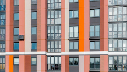 Obraz premium Modern urban apartment buildings with colorful facades. Architectural designs featuring balconies and large windows. Perfect for real estate investment and residential